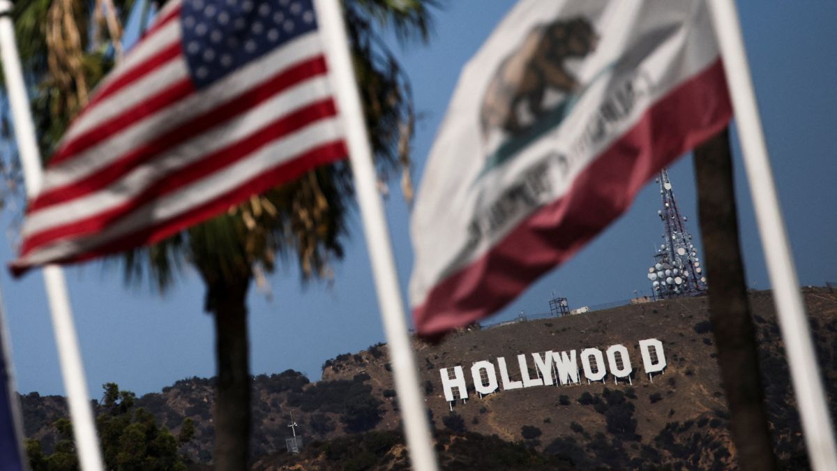 Flags flutter in front of the Hollywood Sign after US President Donald Trump ordered a 100 per cent tariff on foreign-made films in Los Angeles, California, US, September 29, 2025. Reuters Flags flutter in front of the Hollywood Sign after US President Donald Trump ordered a 100 per cent tariff on foreign-made films in Los Angeles, California, US, September 29, 2025. Reuters
