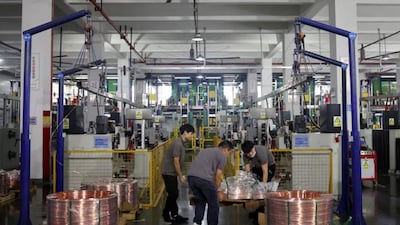 Workers transfer copper rods on a pallet along the production line for copper flat wire at the Wellascent factory in Ganzhou, Jiangxi province, China (Image credit: REUTERS/Florence Lo/File Photo )