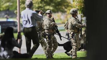 Law enforcement officials patrol the Utah Valley University campus in Orem, Utah. AP