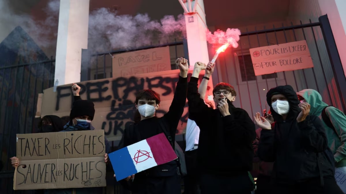 Unions in France protest against looming budget cuts, putting pressure on Macron