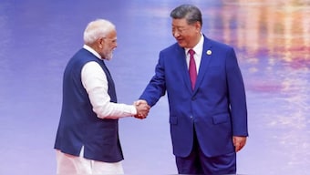 Prime Minister Narendra Modi with Chinese President Xi Jinping during the Shanghai Cooperation Organisation Summit in Tianjin, China, on Sunday. Image: PTI