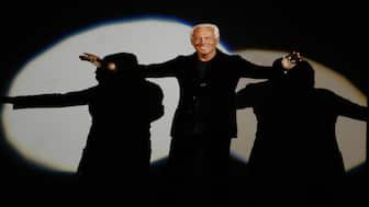 Giorgio Armani receives his share of applause after presenting his Emporio Fall-Winter 2007-2008 men's fashion collection, during the Milan Men's Fashion Week, in Milan, Italy, on Jan. 15, 2007. AP File