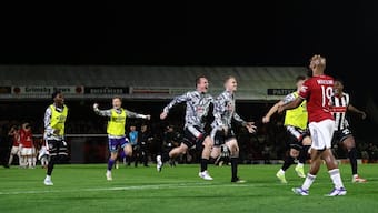 Grimsby Town players celebrate after winning the match against United. Image: Reuters