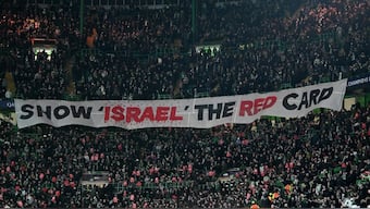 Fans unveil a banner reading 'Show Israel The Red Card' during an UEFA Champions League match. Image: AFP