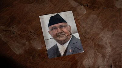 Former Nepal's Prime Minister KP Sharma Oli's picture lies on the floor in the Singha Durbar office complex that houses the prime minister's office and other ministries burnt, following the Gen-Z protests. Reuters