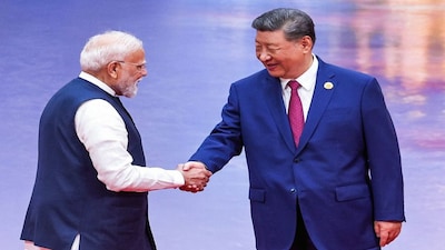Prime Minister Narendra Modi and China's President Xi Jinping shake hands during the welcome ceremony of the Shanghai Cooperation Organization (SCO) summit in Tianjin. File image/AFP