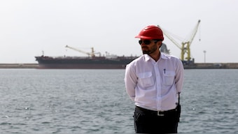 An engineer stands at Shahid Beheshti Port in the southeastern Iranian coastal city of Chabahar, on the Gulf of Oman. The United States has ended the special sanctions waiver for it, which may place India’s flagship connectivity project under unprecedented strain. File image/AFP