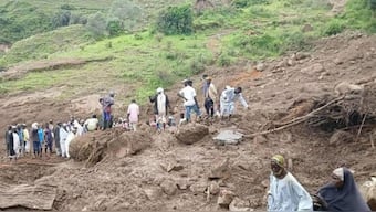 People inspect debris after a landslide that devastated the village of Tarasin in Sudan’s Marra mountains. Photograph: Sudan Liberation MovementArmy. AFP