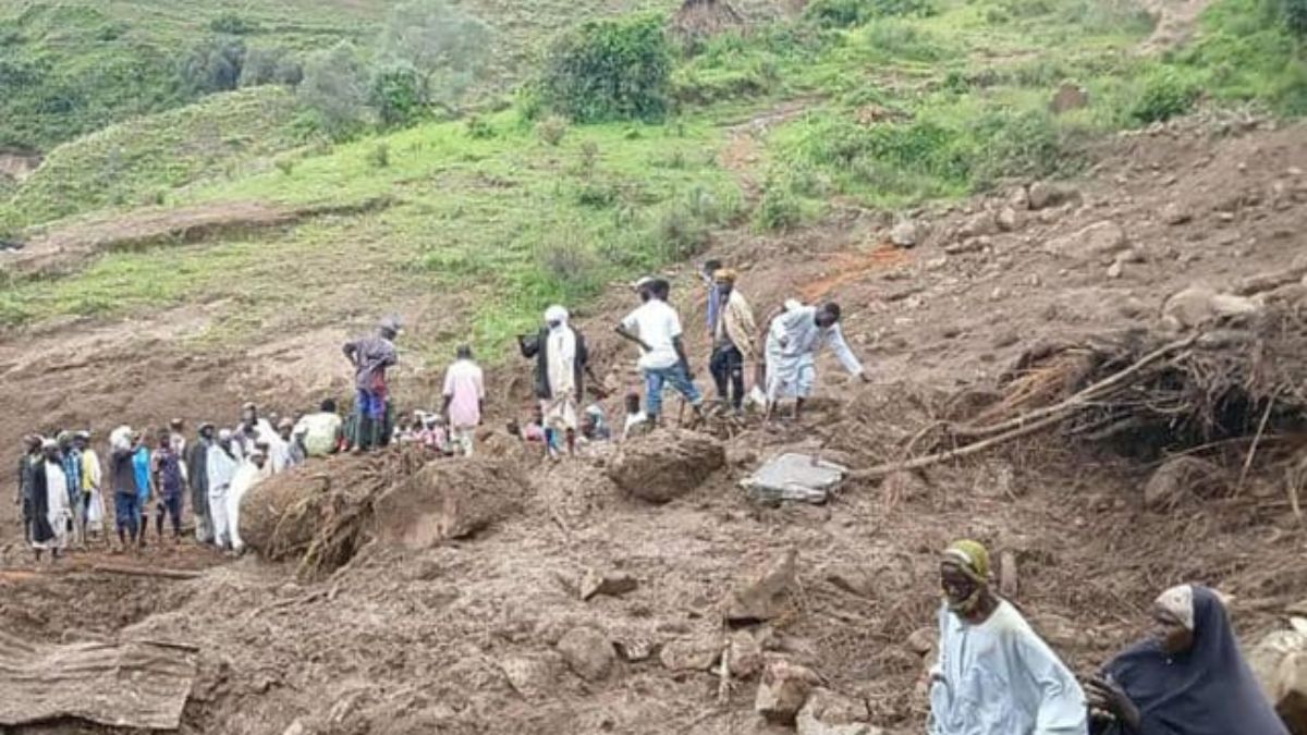 People inspect debris after a landslide that devastated the village of Tarasin in Sudan’s Marra mountains. Photograph: Sudan Liberation MovementArmy. AFP People inspect debris after a landslide that devastated the village of Tarasin in Sudan’s Marra mountains. Photograph: Sudan Liberation MovementArmy. AFP