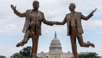The 12-foot statue, built from foam, resin, wood, and wire, is titled “Best Friends Forever”. It  shows Trump and Epstein seemingly walking towards the Washington Monument. AP