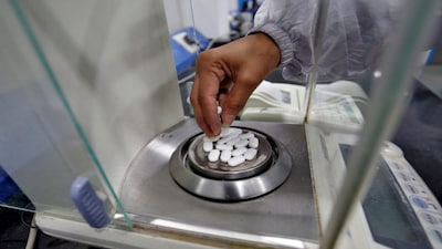 A pharmacist checks weight of Paracetamol, a common pain reliever also sold as acetaminophen, tablets inside a lab of a pharmaceutical company on the outskirts of Ahmedabad, India. In this year alone, India has already exported drugs worth $3.7 billion (Rs 32,505 crore) to the US. File image/Reuters