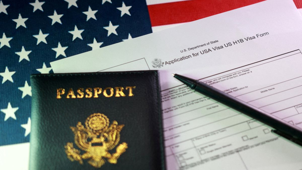 A US flag, a passport and a US H-1B Visa application form are seen in this illustration. Reuters File A US flag, a passport and a US H-1B Visa application form are seen in this illustration. Reuters File