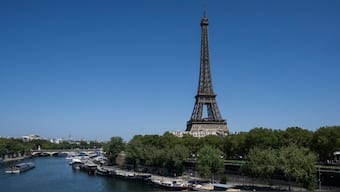 This photograph shows a view the Eiffel tower and the Seine river in Paris on August 11, 2025. File Photo/AFP
