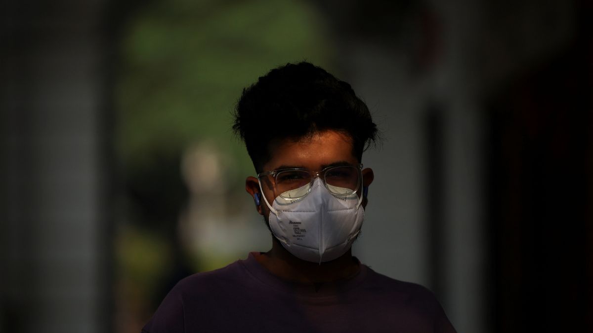 A man walks with a face mask on a smoggy morning after the air quality dipped, partly due to the use of firecrackers during Diwali in New Delhi, October 23, 2025. Reuters A man walks with a face mask on a smoggy morning after the air quality dipped, partly due to the use of firecrackers during Diwali in New Delhi, October 23, 2025. Reuters