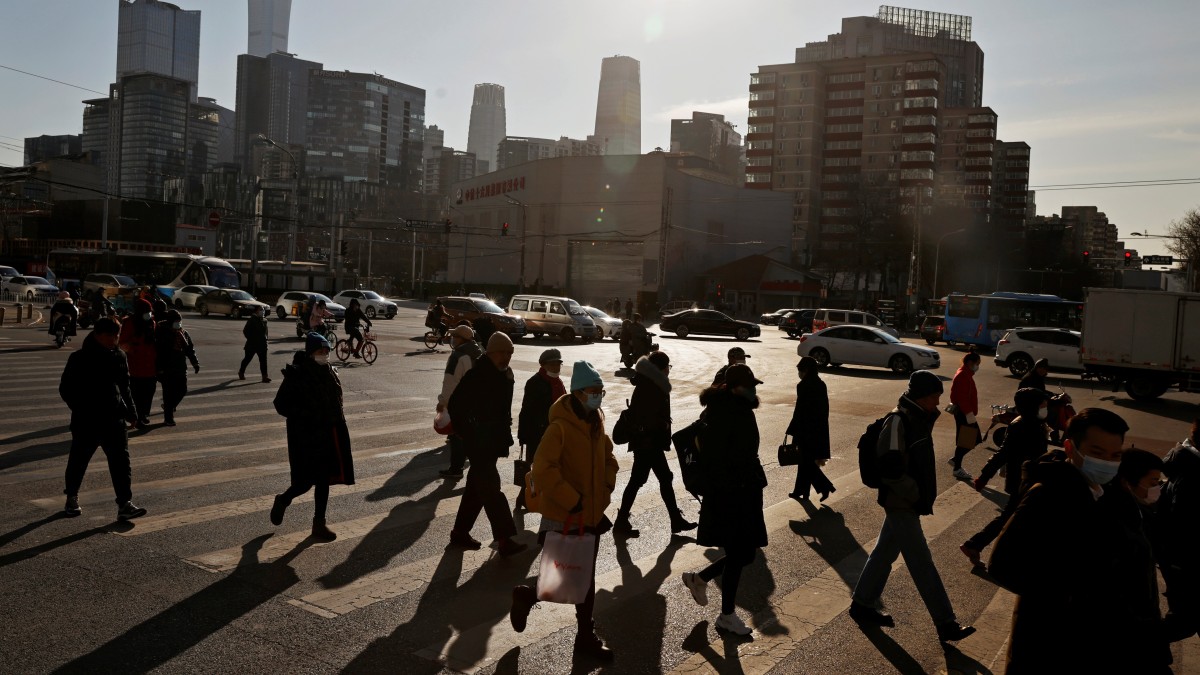 People cross a street during morning rush hour in front of the skyline of the CBD in Beijing. Representational image/Reuters People cross a street during morning rush hour in front of the skyline of the CBD in Beijing. Representational image/Reuters