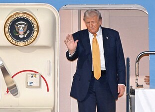 US President Donald Trump waves upon his arrival at Haneda airport in Tokyo, Japan. (Photo: Reuters)