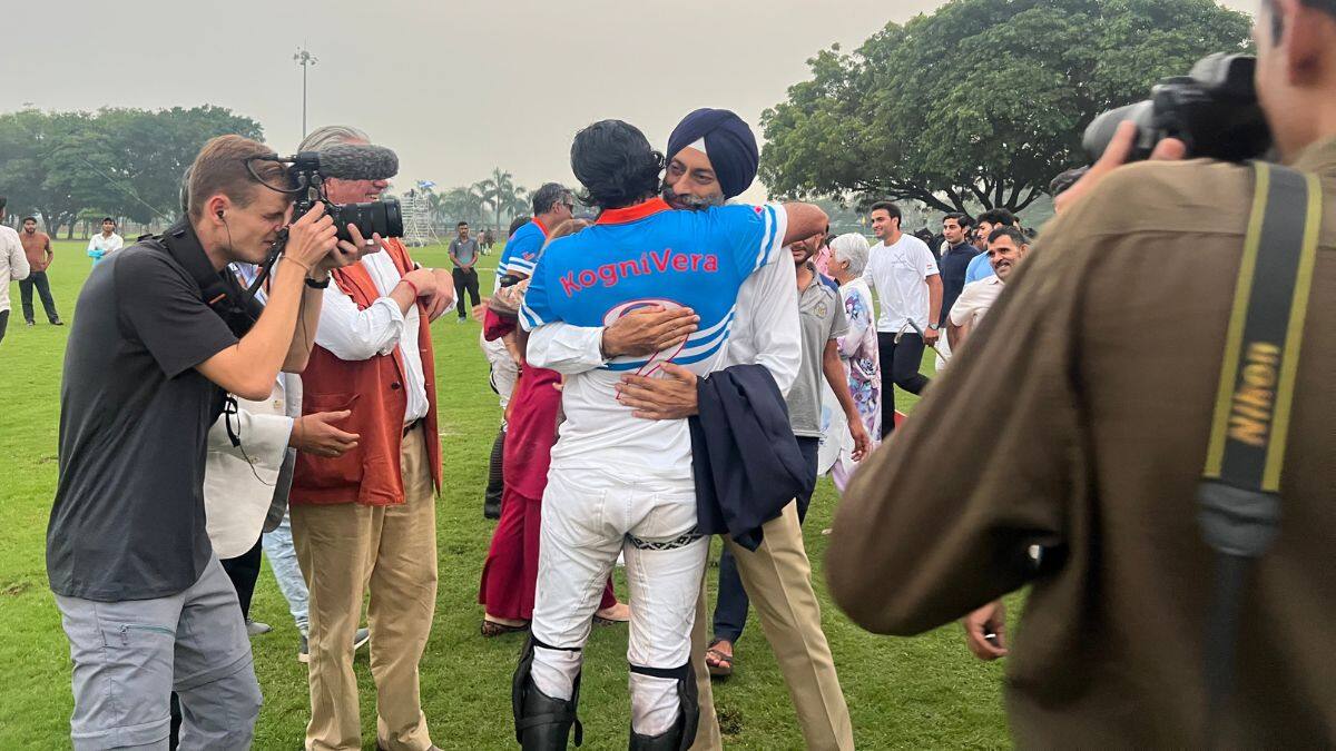 Sawai Padmanabh Singh can be seen embracing Colonel Navjit Sandhu (Retd), former commander of the 61st Cavalry and ex-captain of the national polo team, after India secure their win at the KogniVera International Polo Cup held at the Jaipur Polo Ground, in New Delhi, India on October 25, 2025. Anmol Singla/Firstpost