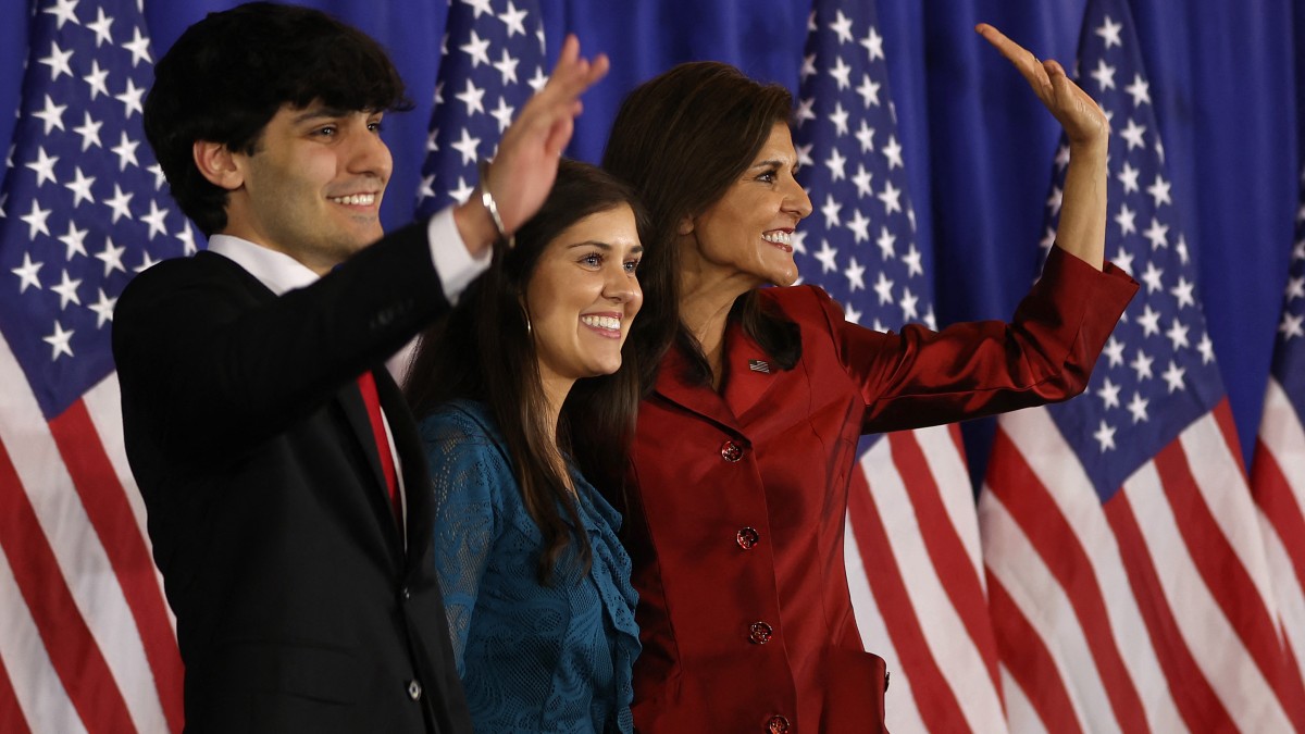 Nikki Haley (R) waves to supporters with son Nalin Haley (L). AFP Nikki Haley (R) waves to supporters with son Nalin Haley (L). AFP