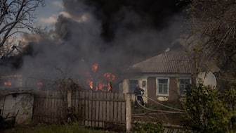 Ukrainian firefighters extinguish the fire in houses following an attack in the Chernihivka village of Pokrovsk district. File photo/ AFP)