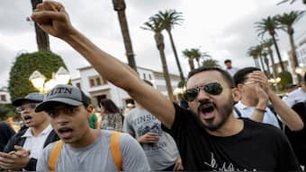 A demonstrator gestures during a protest called for by the self-styled "GenZ212" collective demanding reforms to public healthcare and education in Rabat for the eighth consecutive day on October 3, 2025. AFP