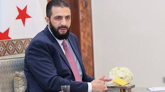 (File) In this photo released by the Syrian official news agency SANA, Syria's interim President Ahmad al-Sharaa receives the final version of the provisional electoral system for the People's Assembly, in Damascus, Syria, Sunday, July 27, 2025. AP