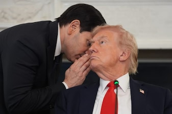 Secretary of State Marco Rubio whispers to President Donald Trump during a roundtable meeting on antifa in the State Dining Room at the White House, Wednesday, Oct. 8, 2025, in Washington. (AP Photo/Evan Vucci)