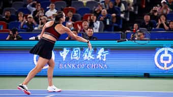World No 1 Aryna Sabalenka throws her racquet in frustration during her semi-final meeting with Jessica Pegula at the Wuhan Open in Wuhan, China. Reuters