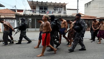 Members of the military police special unit detain suspected drug dealers during a police operation against drug trafficking at the favela do Penha, in Rio de Janeiro, Brazil, on Tuesday. Reuters