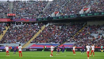 Barcelona and Girona players staged a unique protest against La Liga on Saturday. Image: Reuters