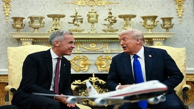 US President Donald Trump meets Canadian Prime Minister Mark Carney in the Oval Office of the White House in Washington, DC on Tuesday. AFP