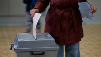A woman casts her ballot for a general election at a poling station in Brno, Czech Republic, on Friday. AP