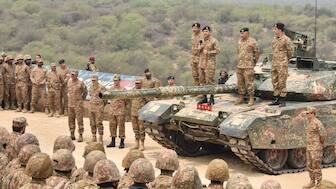 This handout photograph taken on May 1, 2025, and released by the Pakistan's Inter Service Public Relation (ISPR) shows Pakistan's Army Chief General (now Field Marshal) Syed Asim Munir standing on a tank and speaking with troops at the Tilla Field Firing Ranges in Jhelum, Punjab. (Photo: ISPR/AFP) 