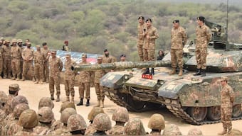 This handout photograph taken on May 1, 2025, and released by the Pakistan's Inter Service Public Relation (ISPR) shows Pakistan's Army Chief General (now Field Marshal) Syed Asim Munir standing on a tank and speaking with troops at the Tilla Field Firing Ranges in Jhelum, Punjab. (Photo: ISPR/AFP) 