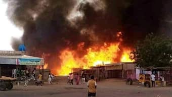 A man stands by as a fire rages in a livestock market area in El-Fasher, the capital of Sudan's North Darfur state, on September 1, 2023, in the aftermath of bombardment by the paramilitary Rapid Support Forces (RSF). (Representational Photo, Credit: AFP)