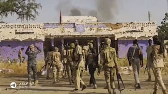 This image grab taken from handout video footage released on Sudan's Rapid Support Forces (RSF) Telegram account on October 26, 2025, shows RSF fighters holding weapons and celebrating in the streets of El-Fasher in Darfur region. (Photo: RSF/AFP) 