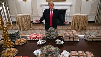 President Donald Trump talks to reporters about the table full of fast food in the State Dining Room of the White House in Washington, Jan. 14, 2019, for the reception for the Clemson Tigers. (Photo: Susan Walsh/AP)