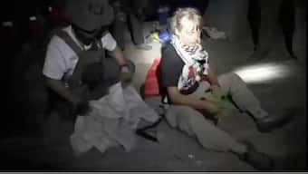 A screengrab from a video shows Swedish activist Greta Thunberg sitting next to a person wearing tactical gear, as vessels of the Global Sumud Flotilla are being intercepted by Israeli security forces, October 1, 2025. Image/Israel Foreign Ministry via Reuters