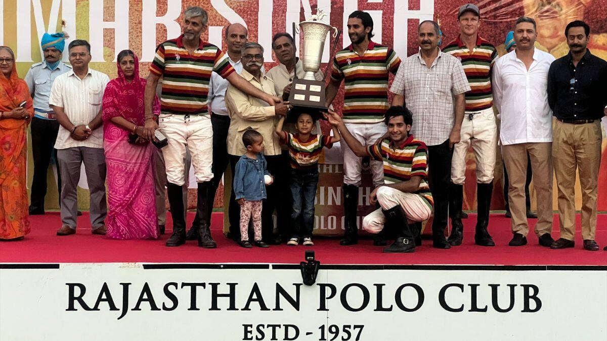 (L to R) Angad Kalaan, HH Sawai Padmanabh Singh, Br Devvrat Singh Jhalamand and Lance Watson lift the trophy for the Gen. Amar Singh Kanota Cup at the Rambagh Polo Ground in Jaipur on September 28, 2025. Anmol Singla/Firstpost