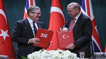 Britain's Prime Minister Keir Starmer and Turkey's President Recep Tayyip Erdogan look on after signing an $11 billion agreement for 20 Eurofighter jets, at the Presidential Palace in Ankara on Monday. AFP
