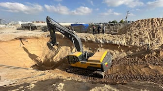 Heavy machinery operates at a site where searches are underway for deceased hostages kidnapped by Hamas during the October 7, 2023, attack on Israel, amid a ceasefire between Israel and Hamas, in Khan Younis, southern Gaza Strip, on Tuesday. Reuters