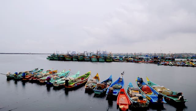 Boats docked at Kasimedu fishing harbour following the heavy rainfall forecast owing to Cyclone 'Montha'. PTI