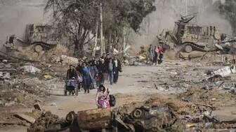Palestinians flee south via Salah al-Din Road, in central Gaza, on the third day of a temporary ceasefire between Israel and Hamas on November 26, 2023. File Photo- AP
