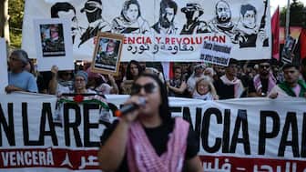 Protesters take part in a demonstration in solidarity with the Palestinians in the Gaza strip, in Madrid on October 4, 2025.- AFP