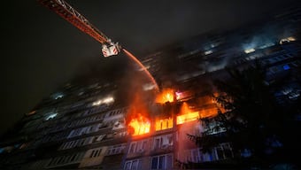 Emergency services personnel work to extinguish a fire following a Russian attack in Kyiv, Ukraine, Friday, Oct. 10, 2025. (AP Photo/Dan Bashakov)

