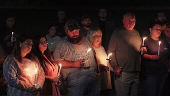 Residents attend a vigil honoring the victims of a blast at an explosives plant, Accurate Energetic Systems, on Friday, Oct. 10, 2025, in Centerville Tenn. (AP Photo/Obed Lamy)