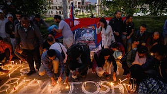 Mourners light candles and offer condolences in Kathmandu on October 15, 2025, during a candlelight vigil held for Bipin Joshi, a deceased Nepali agricultural student who died while being held hostage in Gaza by the Palestinian militant group Hamas. Image-AFP