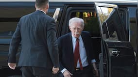 Ex-Trump adviser Bolton arrives at court to surrender on charges of mishandling classified information