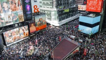 Thousands of protesters fill Times Square during a "No Kings" protest Saturday, Oct. 18, 2025, in New York. (AP Photo/Olga Fedorova)

