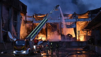 Ukrainian firefighters extinguish a fire at the site of a food warehouse following a Russian missile strike in Kyiv early on October 25, 2025, amid the Russian invasion of Ukraine.  Image- AFP