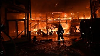 A Ukrainian firefighter struggles to extinguish a fire ravaging the Barabashovo market following an airstrike in Kharkiv on October 1, 2025 amid the Russian invasion of Ukraine. Image- AFP
